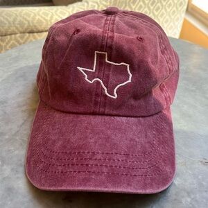 Texas theme hat. Color is a washed wine.